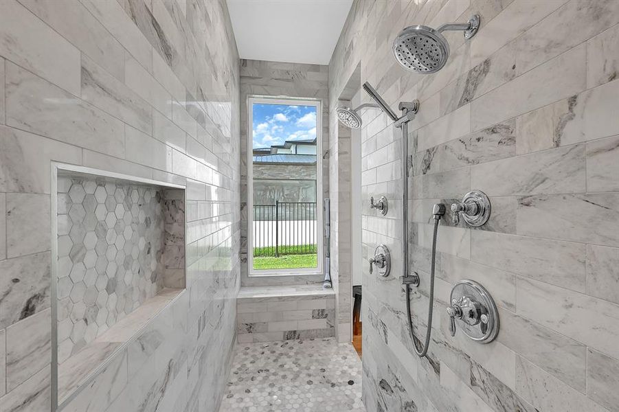 Bringing the octagon tile to the shower with built-in shelving and bench seat.