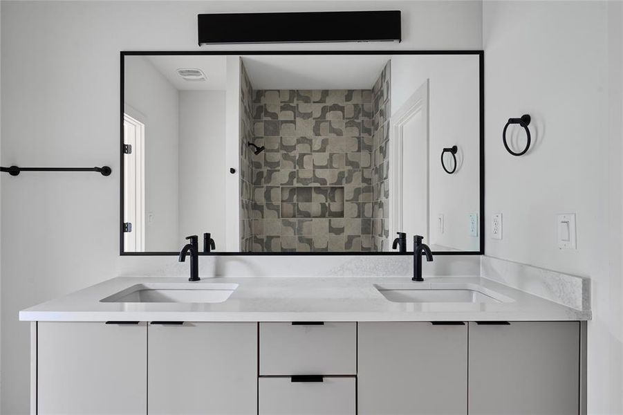 secondary bathroom with dual vanities