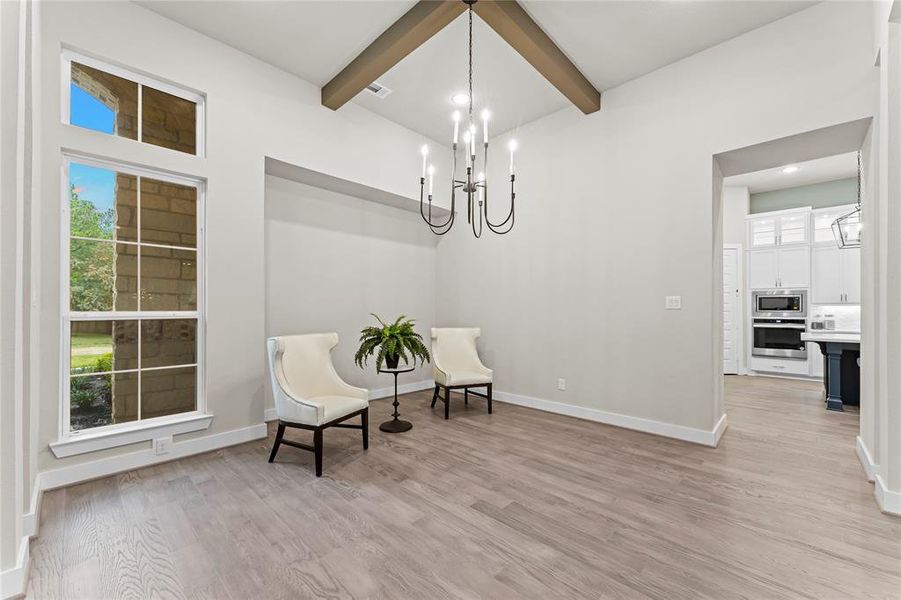 Formal Dining with Engineered Hardwood Flooring, Ceiling Detail, and Direct Access to the Kitchen.