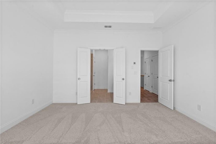 Primary Bedroom with nice double doors leading to private bathroom