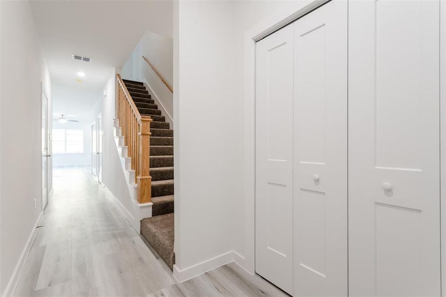 Hall with light wood-type flooring