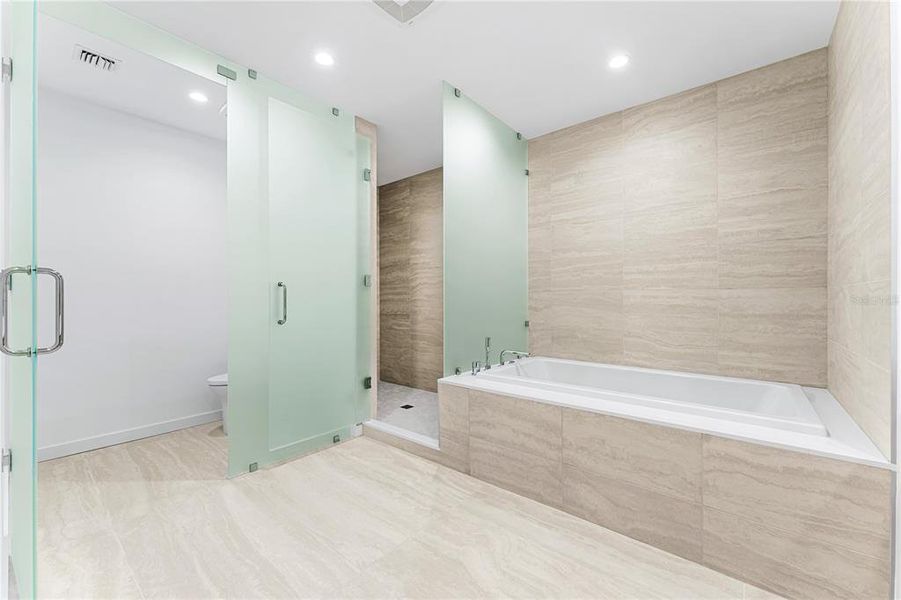 Primary bathroom, spa-like bath retreats with glass wall partitions