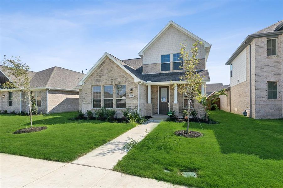 Craftsman inspired home with a front lawn