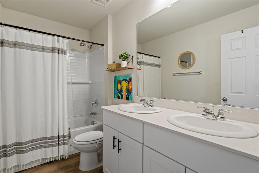 A full bathroom on the second level is strategically placed between the two bedrooms.