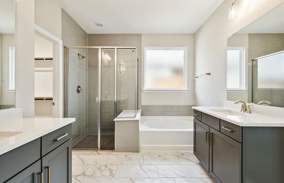 Elegant owner's bathroom with premium finishes *real home pictured