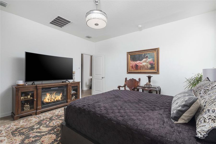 Bedroom with hardwood / wood-style flooring