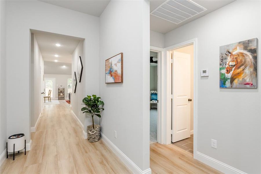 Corridor featuring light hardwood / wood-style flooring