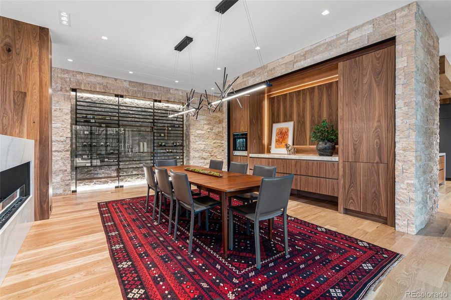 Jerusalem limestone accent wall with 368 bottle wine rack and built-in walnut buffet with exquisite Shiloh cabinets and Pental Quartz slab counter. Featuring a Dacor 4-bottle chilled wine dispenser ensuring every pour is effortless.