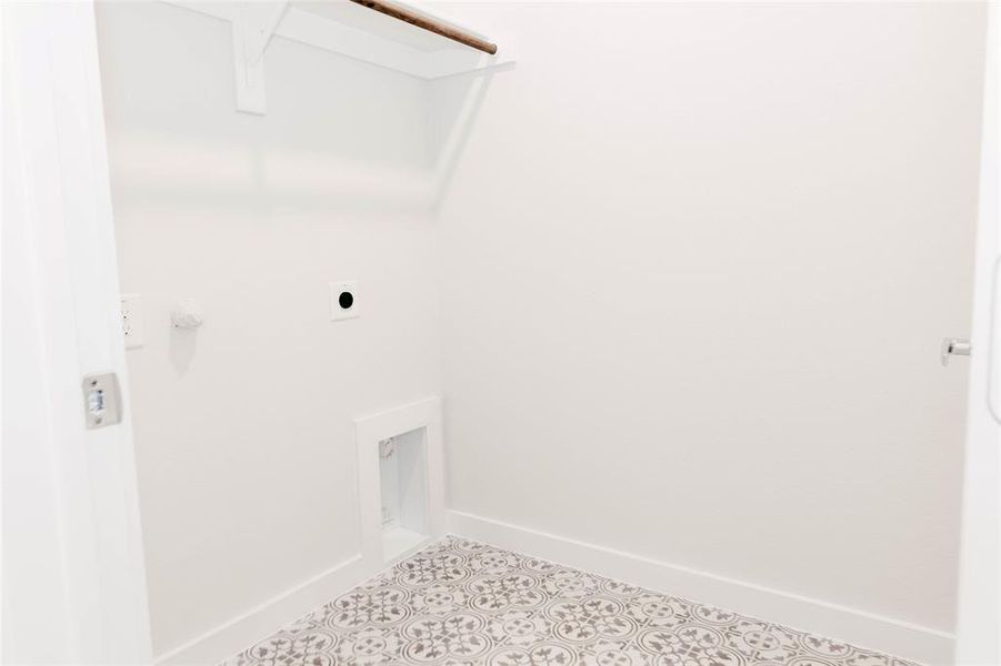 Washroom featuring tile patterned floors and electric dryer hookup