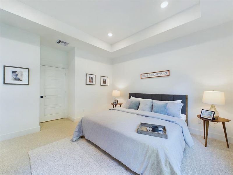 Elegant Primary Bedroom located on the 2nd floor. The high ceilings, with recessed lighting, are prewired and blocked for ceiling fans (not included). Model home photos, finishes and floor plan MAY VARY! Ceiling fans are NOT INCLUDED!