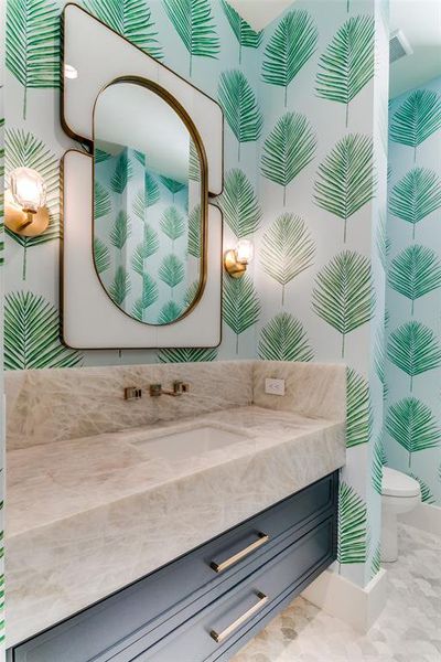 Bathroom with vanity, tile patterned floors, and toilet