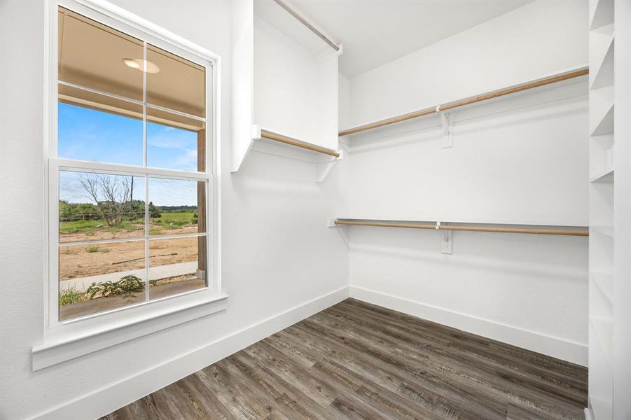 Primary walk-in closet with built-ins