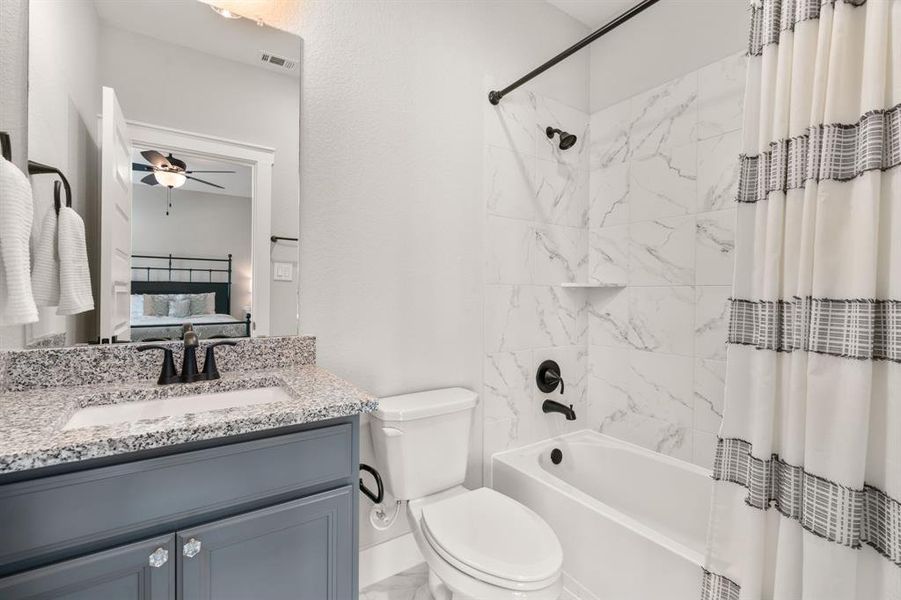 Ensuite bathroom located in the guest room on the second floor.