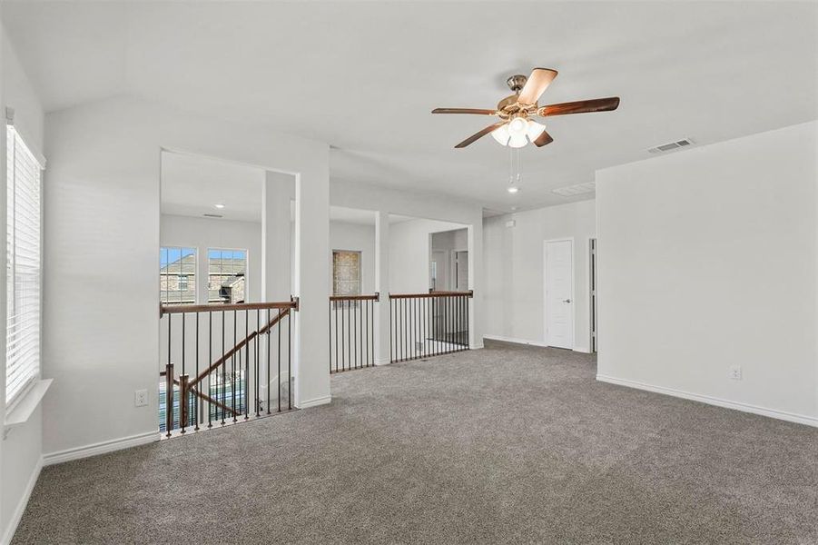 game room with ceiling fan and carpet floors