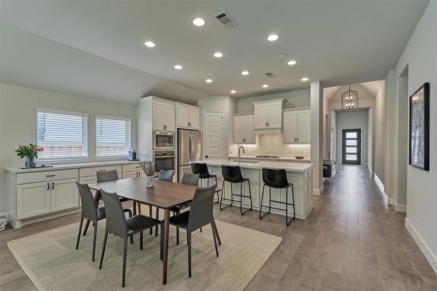 Wow! Home shows like a model! Storage abounds here with upgraded 42" cabinets plus bonus buffet storage that extends alongside the breakfast room for added convenience.