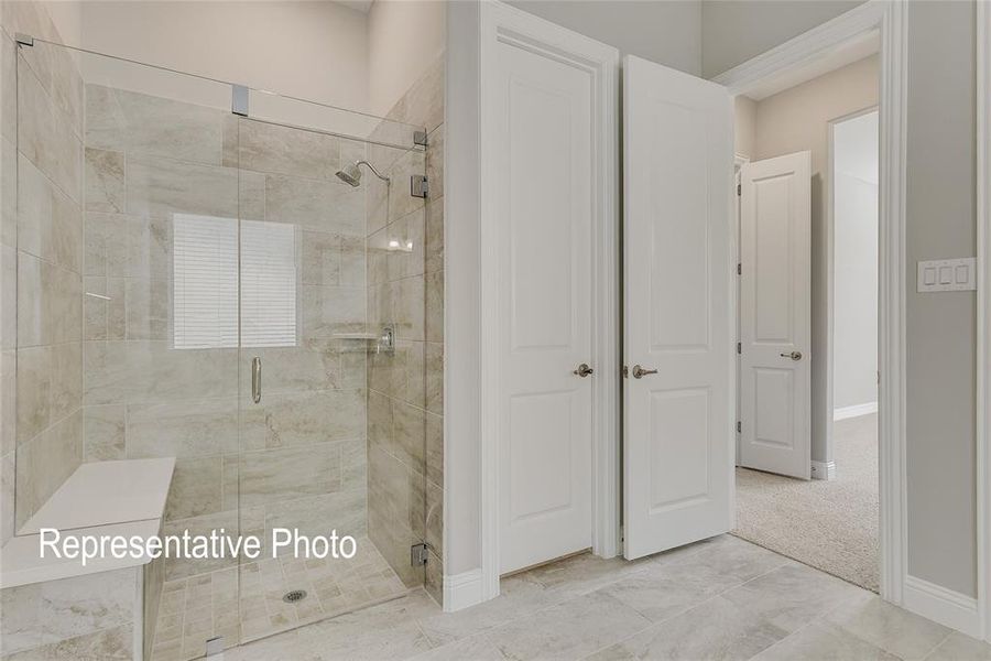 Bathroom featuring tile patterned floors and walk in shower