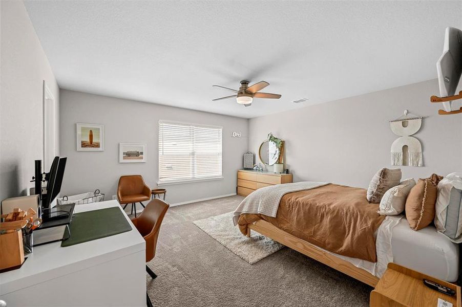 Bedroom with light carpet and ceiling fan