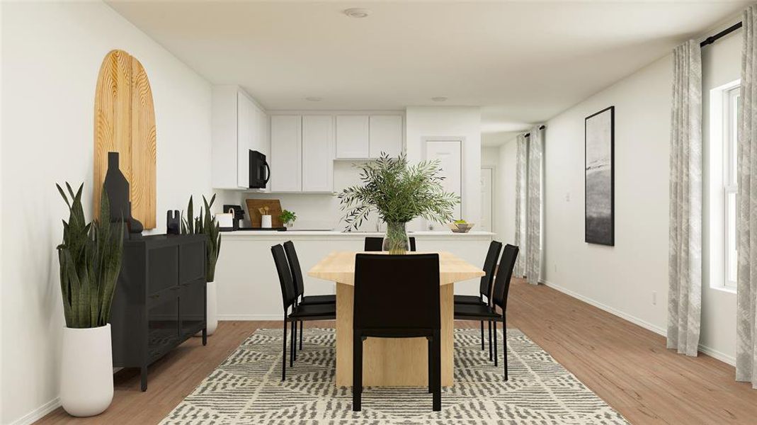 Dining area with light hardwood / wood-style floors