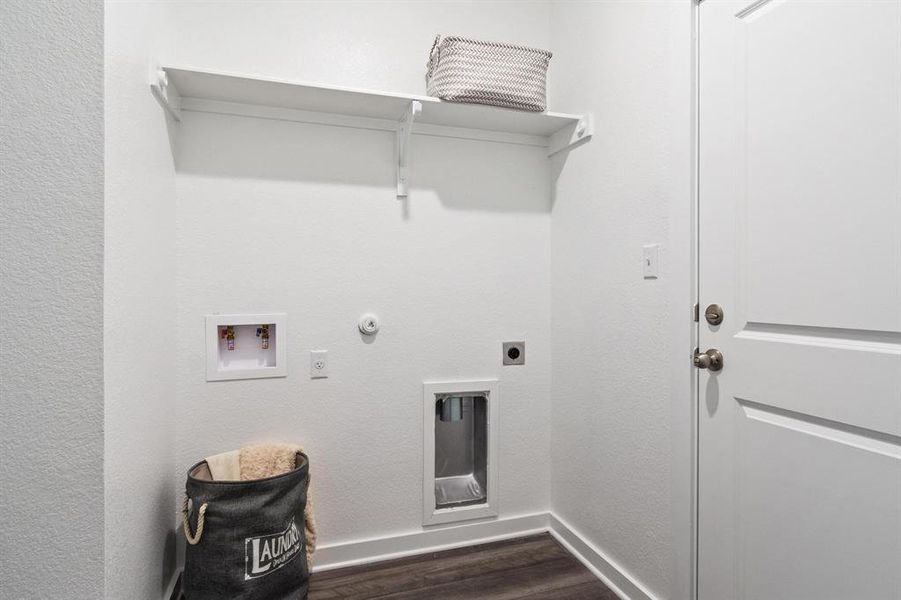 laundry room leading to 2-car attached garage