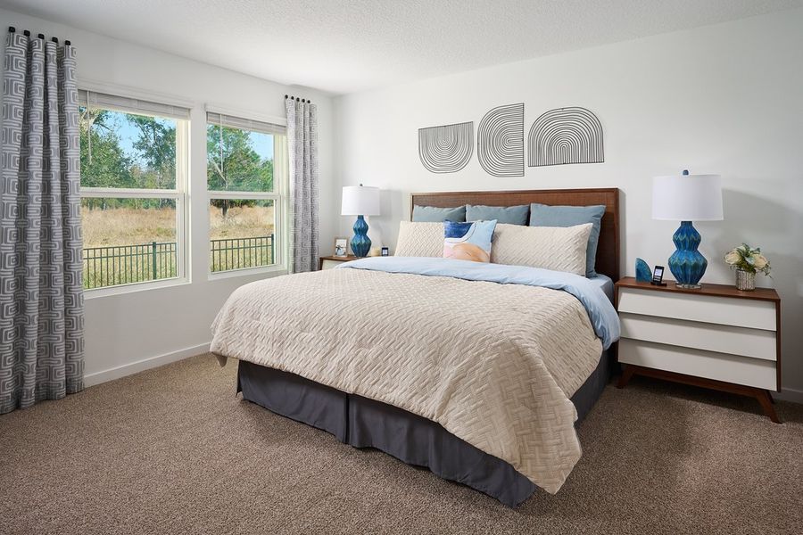 Primary bedroom of the Olympic plan modeled at Lakes at Bella Lago.