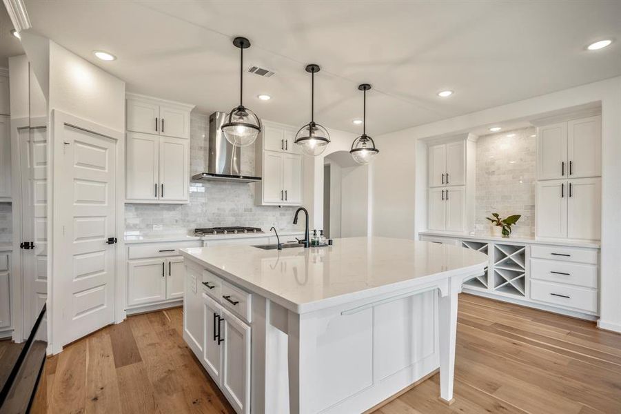 On the other side of the kitchen, The sellers upgraded with a built in hutch for additional storage! It's the perfect area for a coffee or wine bar.