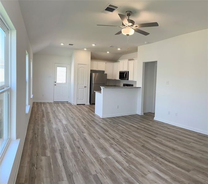 The kitchen overlooks the living room and dining area so that you never miss a beat as you prep your next meal.