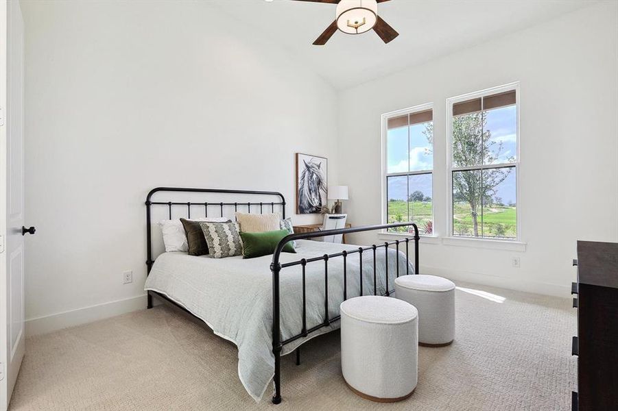 Bedroom featuring carpet, ceiling fan, and lofted ceiling