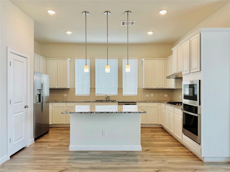 Kitchen with island and pendant lighting