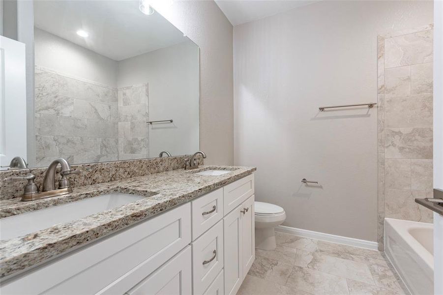 Upstairs bathroom has double sinks and lots of drawer space