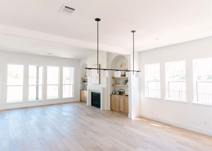 Unfurnished living room featuring light hardwood / wood-style flooring