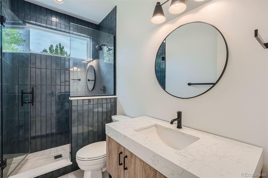 Main level guest bath with walk-in shower.