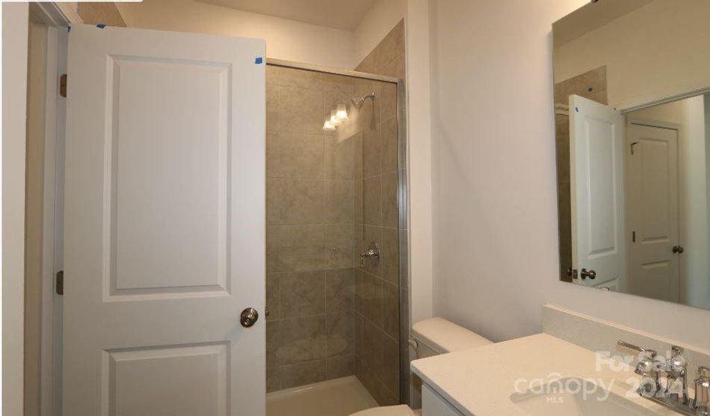 Downstairs bath with large tiled shower