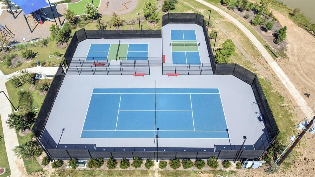 Modern pickleball and tennis courts designed for active play, featuring well-maintained surfaces and ample space for both casual and competitive games. Ideal for all skill levels.