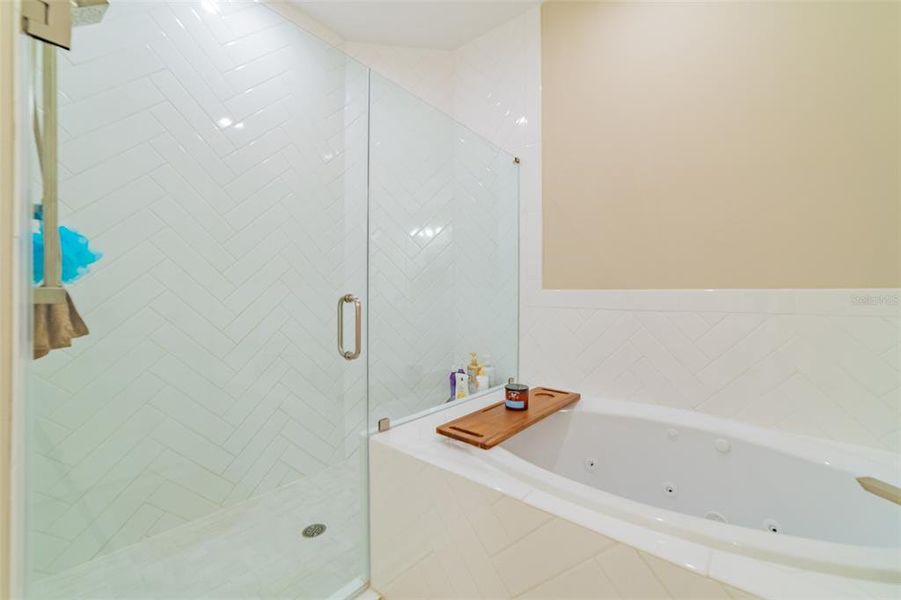 Walk-in shower with herringbone pattern tile