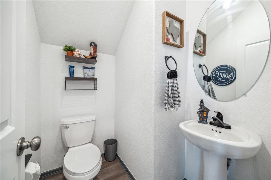 This conveniently located first-floor powder room offers both style and function. With an easy-access location, it's perfect for guests and daily use without interrupting the flow of the main living areas.