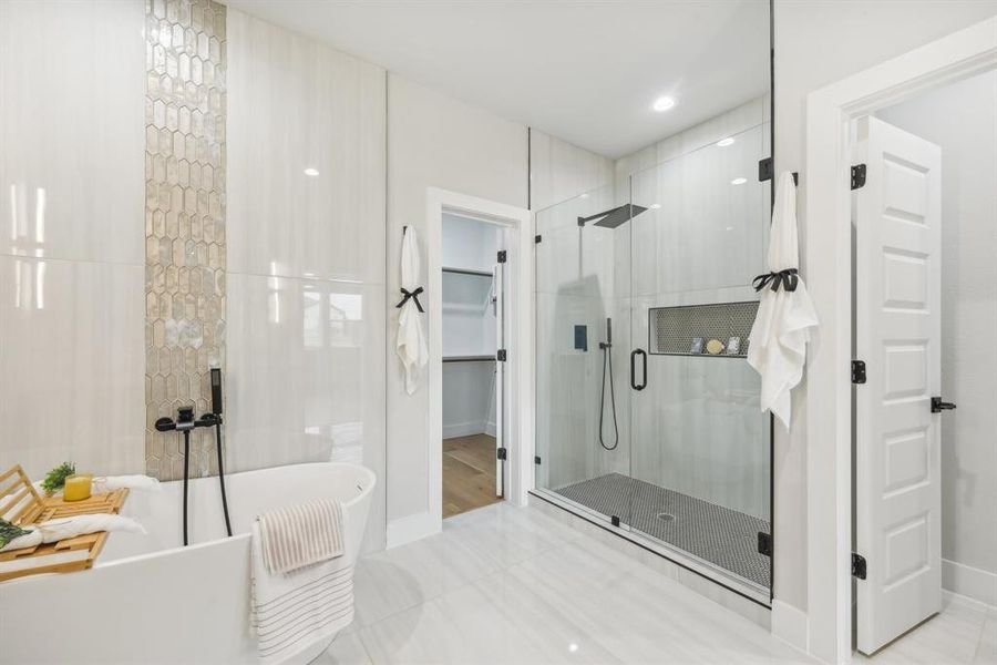 Bathroom with separate shower and tub and tile patterned flooring