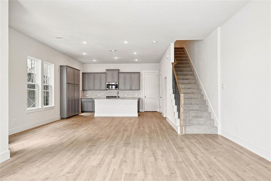 Unfurnished living room featuring light hardwood / wood-style flooring