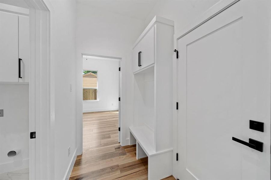 Mudroom featuring light wood-type flooring