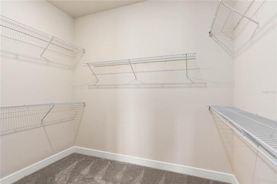Owner's Walk-in Closet. Model Home Design. Pictures are for illustrative purposes only. Elevations, colors and options may vary. Furniture is for model home staging only.