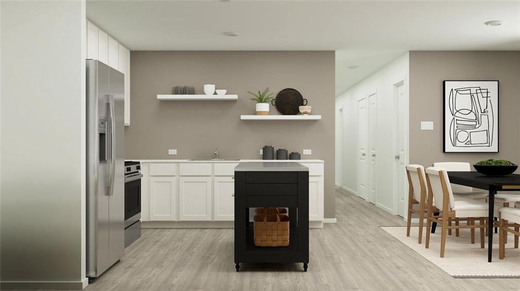 Kitchen featuring stainless steel appliances, white cabinetry, sink, and light hardwood / wood-style flooring