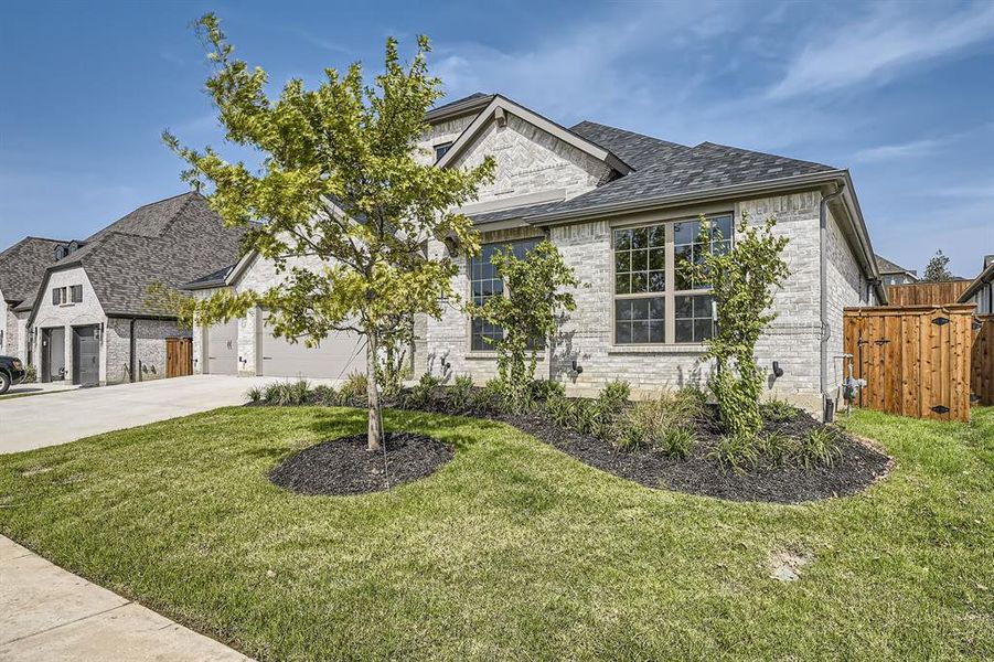 View of front of house with a front yard