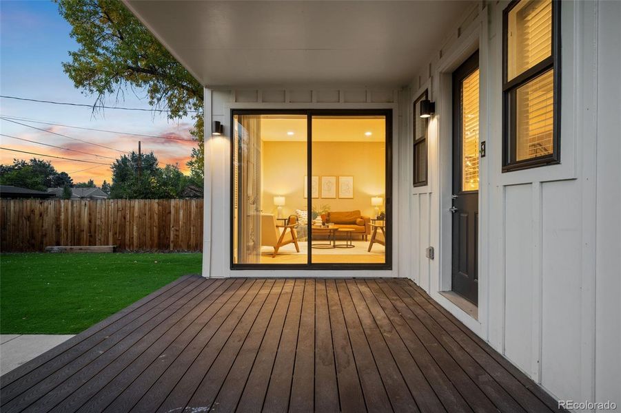 Covered backyard patio is perfect for entertaining or enjoying a dinner or book.