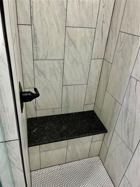 Bathroom with a tile shower