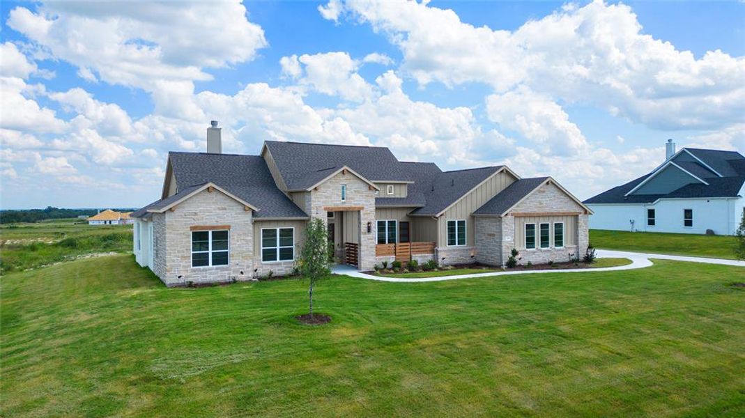 View of front of house featuring a front lawn