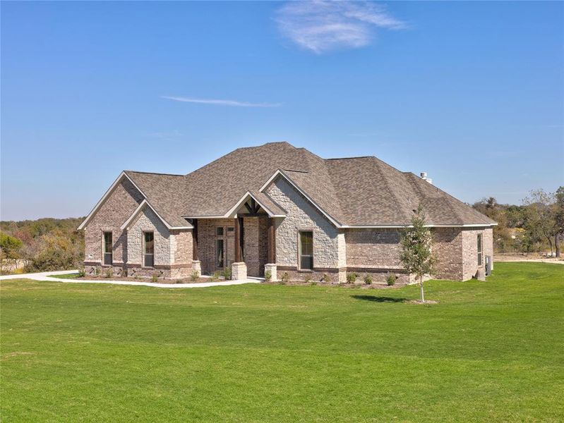 View of front of property featuring a front lawn