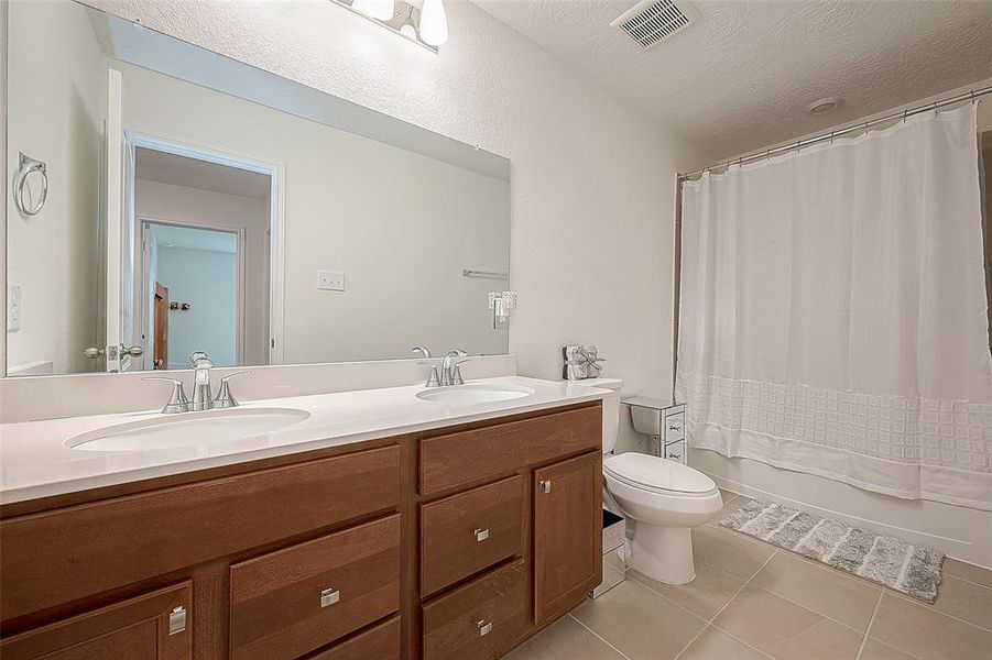 Upstairs guest bathroom with double sinks