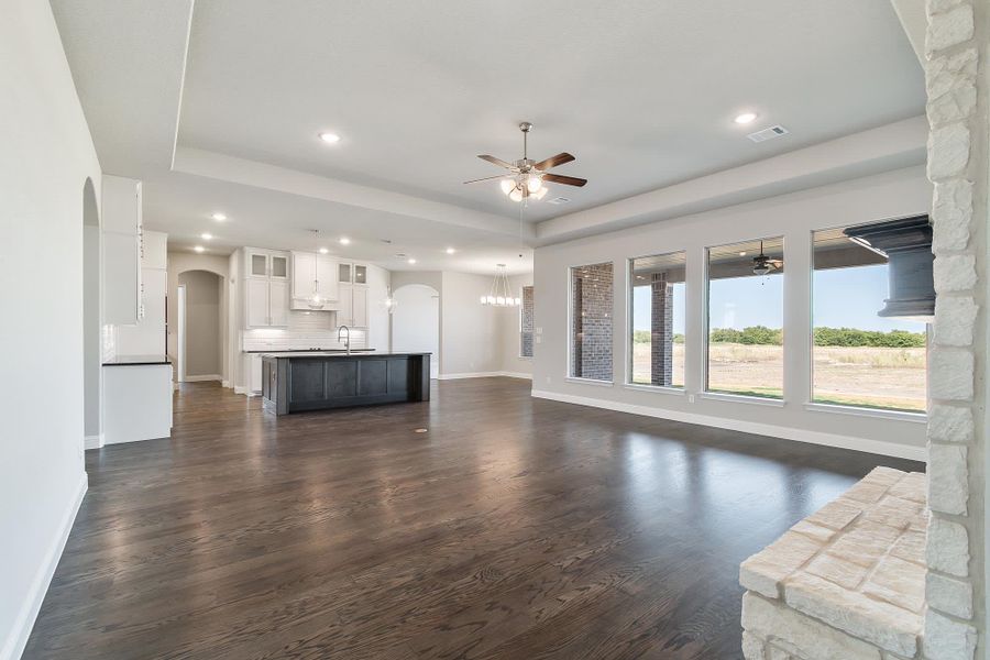 Family Room to Kitchen | Concept 3634 at The Meadows in Gunter, TX by Landsea Homes