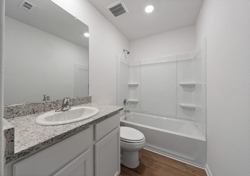 The secondary bathroom has plenty of storage