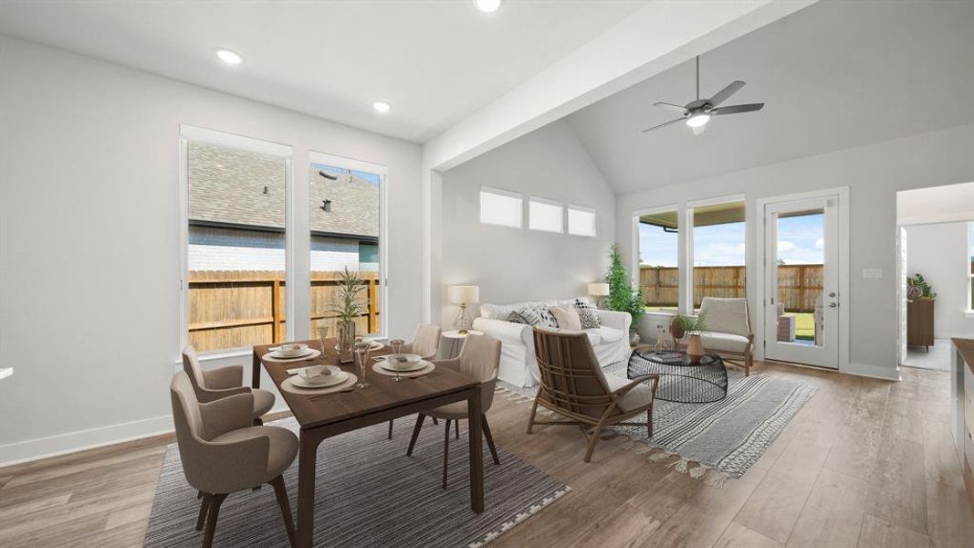 Whether it's a simple night in or entertaining family and friends, this home has ample open space for everyone to enjoy! Featuring an open layout, modern ceiling fan, recessed lighting, and luxurious wood look floors, this living space offers it all. *This room has been virtually staged