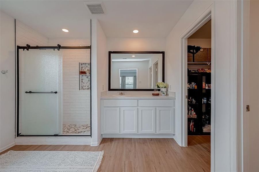 Primary Bathroom with a custom super shower & closet